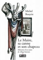Le maire, sa canne et son chapeau