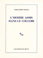 Homme Assis Dans Le Couloir