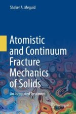 Atomistic and Continuum Fracture Mechanics of Solids