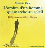 L'ombre d'un homme qui marche au soleil
