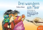 Drei wandern am Meer